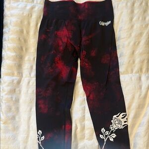Artistic Red and Black Leggings with Floral Accents